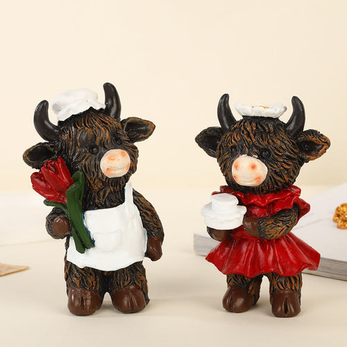 Desktop ornaments featuring a pair of cows as decorative items